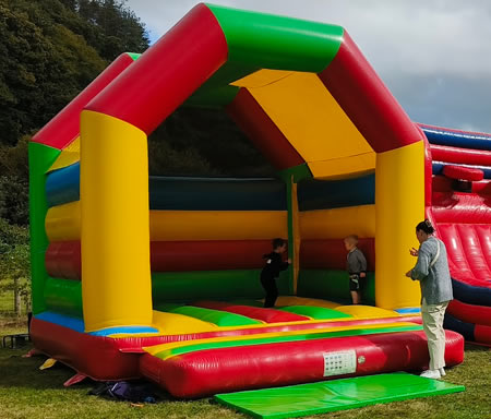 Rainbow Bouncy Castle Hire Wales Rainbow A-Frame Bouncy Castle Hire Wales